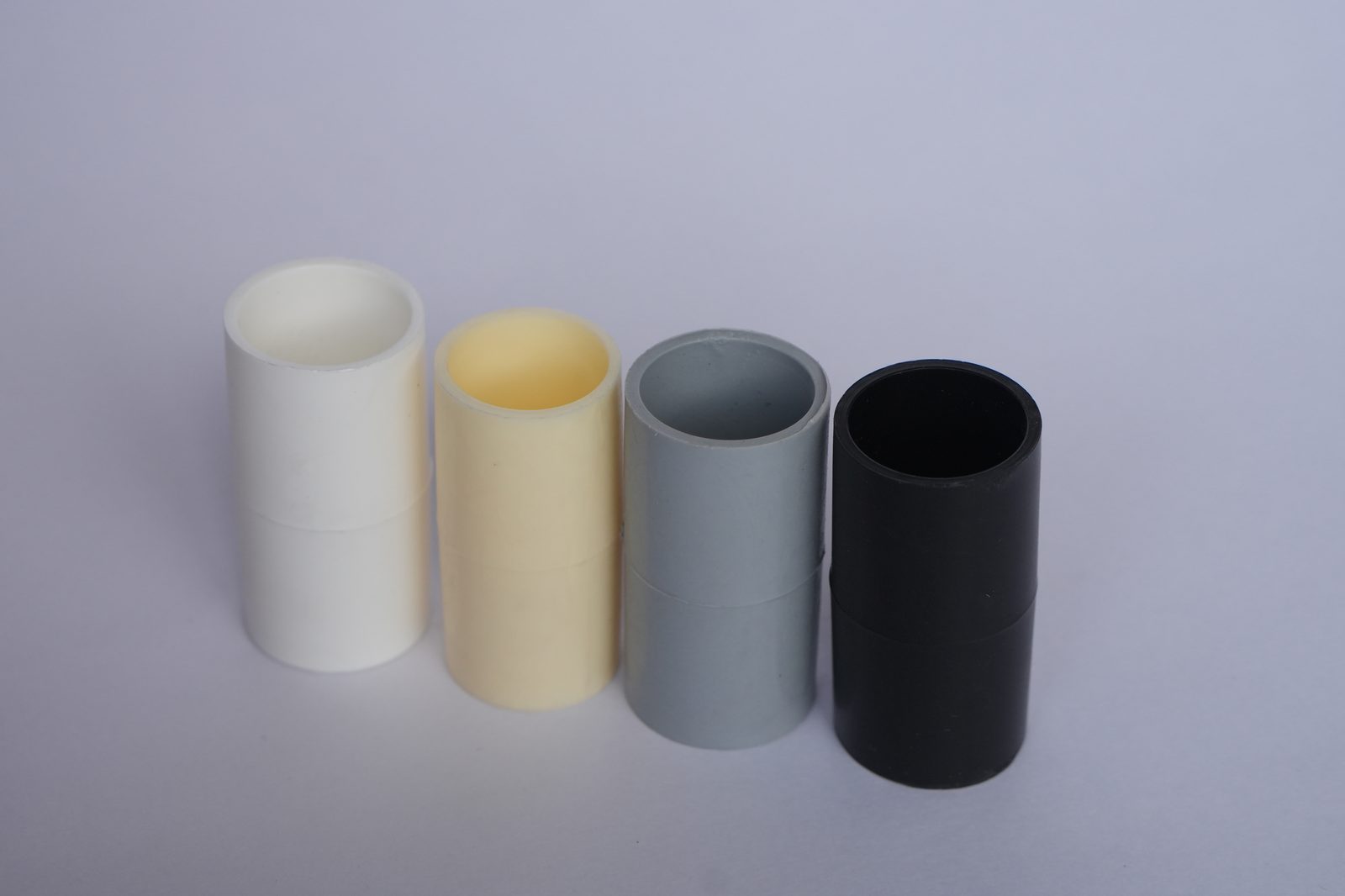 Matha PVC conduit couplers in white, ivory, grey and black